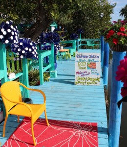 Yellow Chair on a Sky Blue Dock