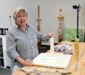 Diane demonstrating strips her canvases are made of